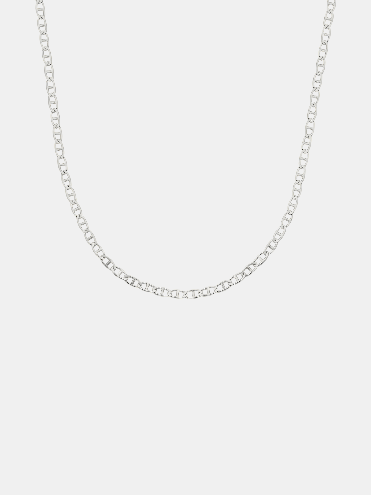 Silver chain necklace on a light gray background