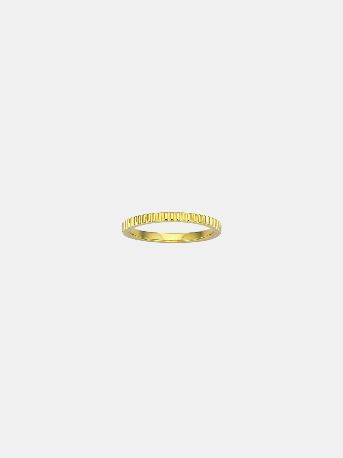 Gold ring on a light beige background