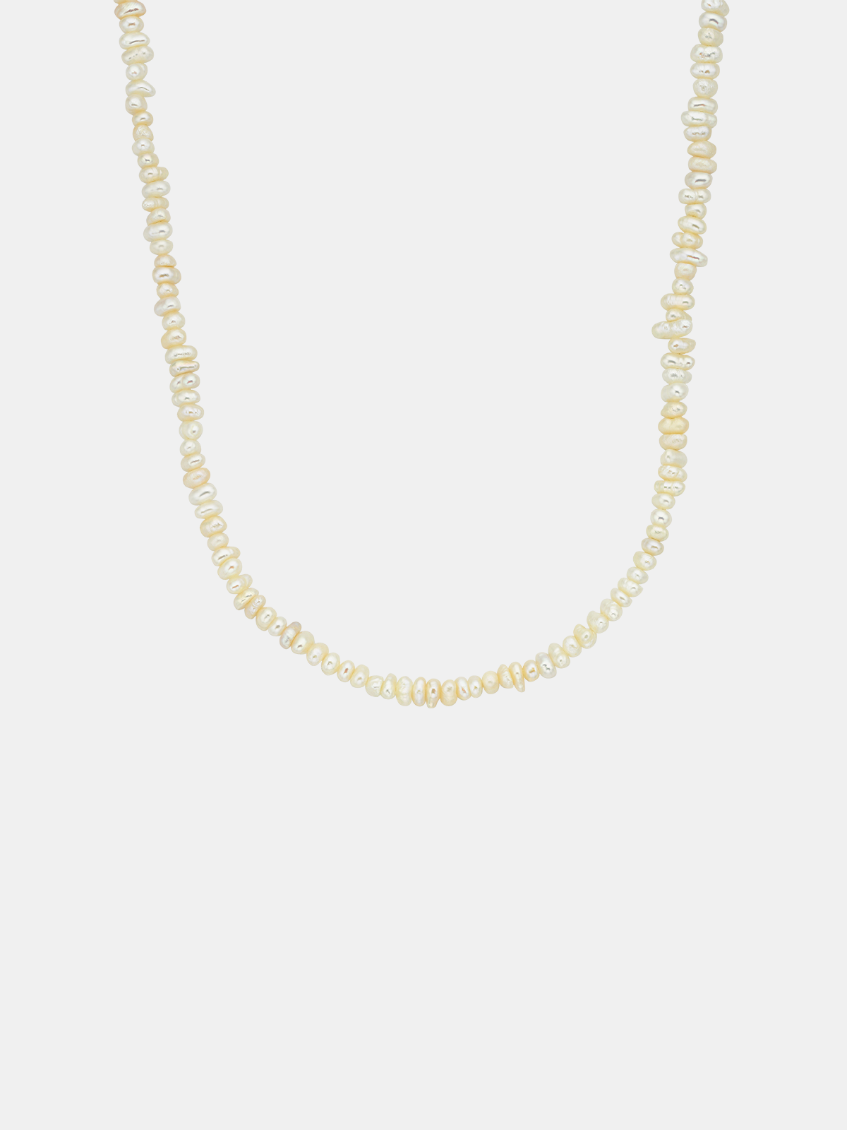Pearl necklace on a light gray background