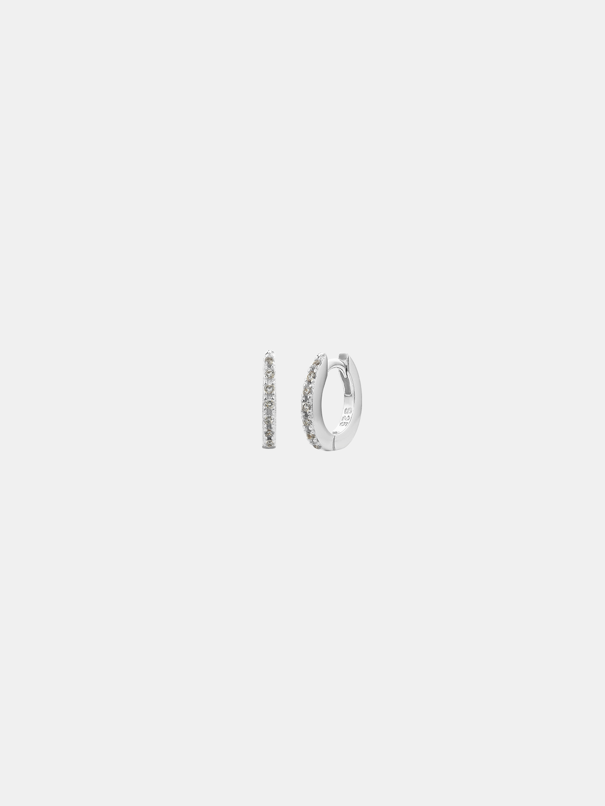 Pair of silver hoop earrings on a light gray background