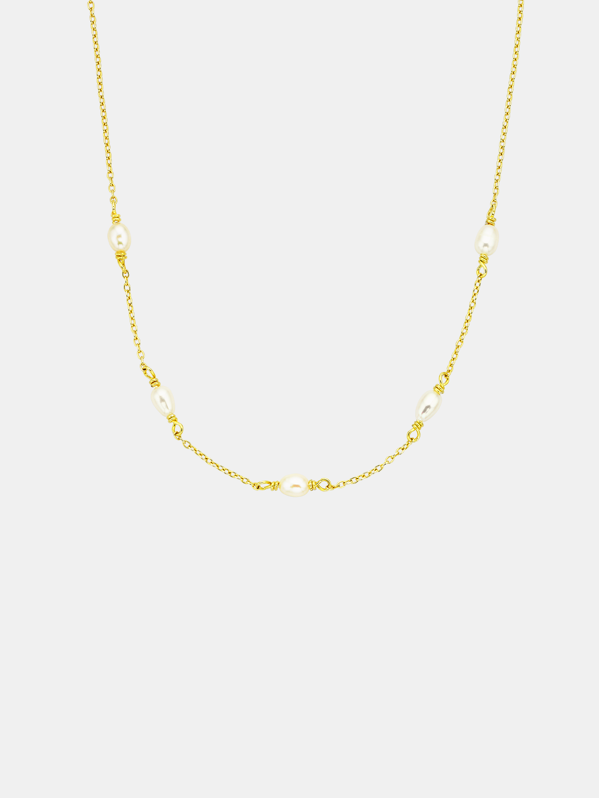 Gold chain pearl necklace on a white background