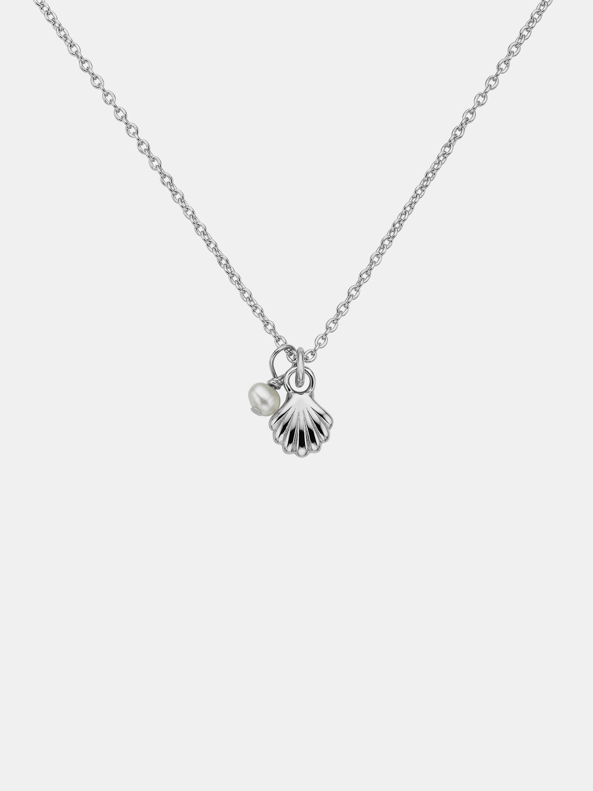 Necklace with shell and pearl charm on a white background