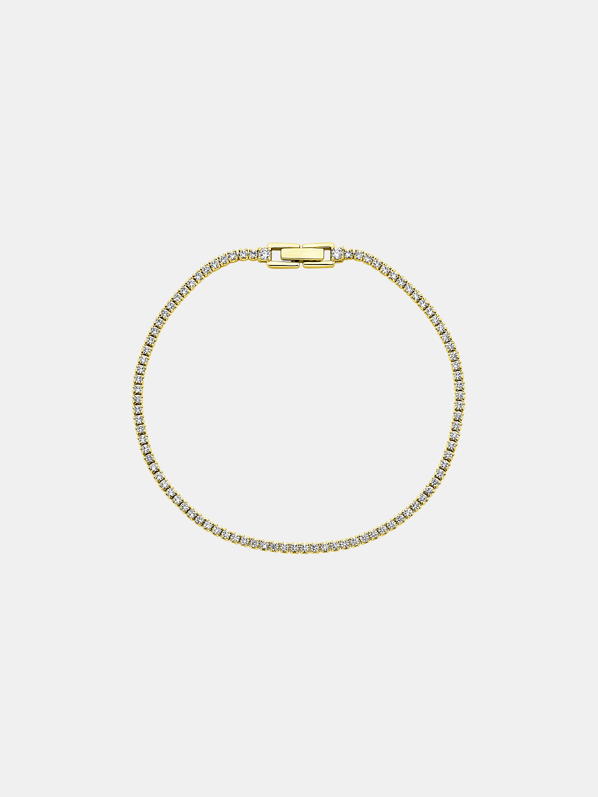 Gold bracelet with zircons on a light gray background