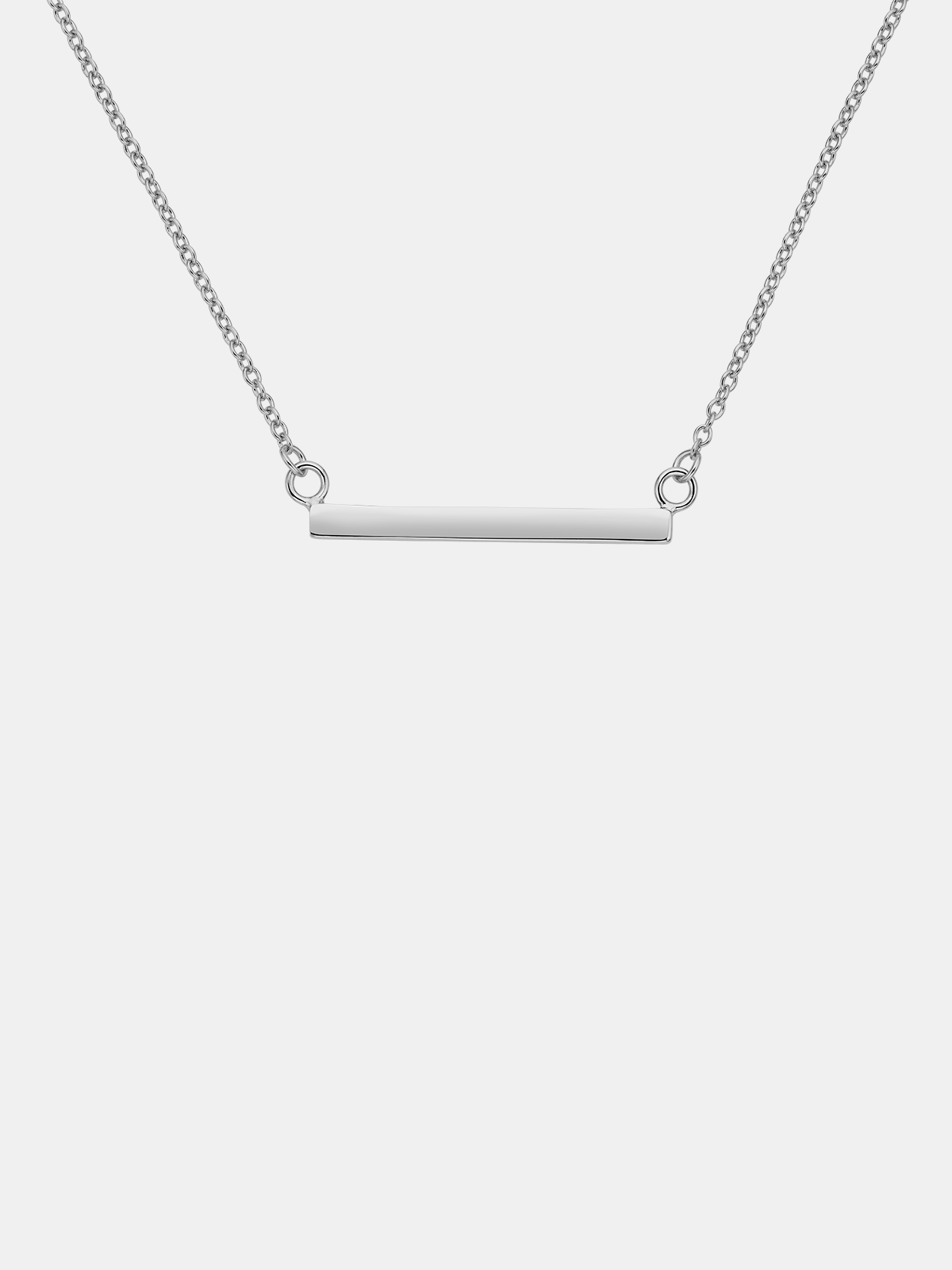 Silver necklace with a bar pendant on a white background