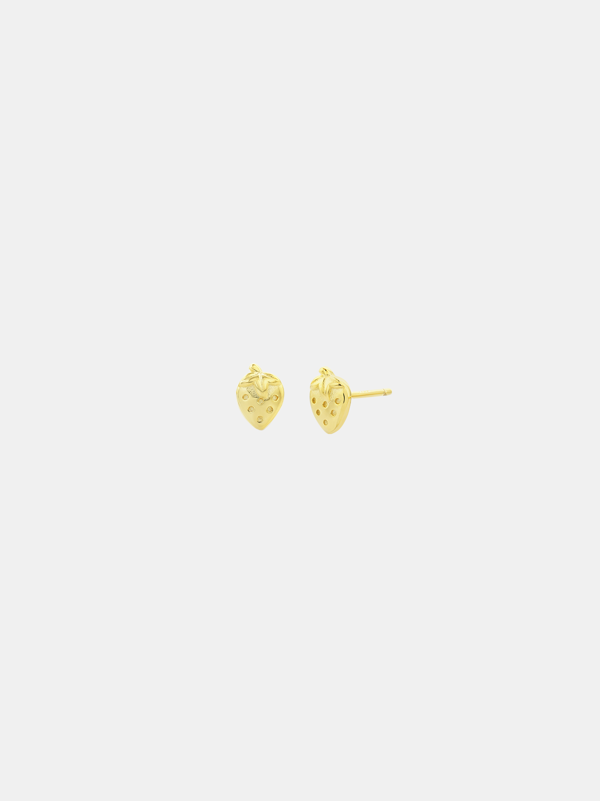 Pair of gold strawberry-shaped stud earrings on a white background