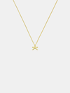 Gold necklace with a bow pendant on a light gray background