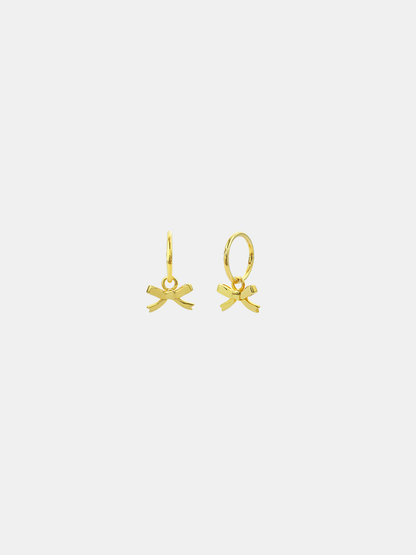 Gold bow-shaped earrings on a white background