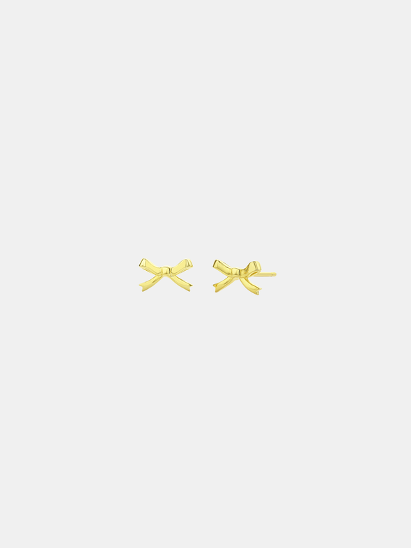 Gold bow-shaped earrings on a white background