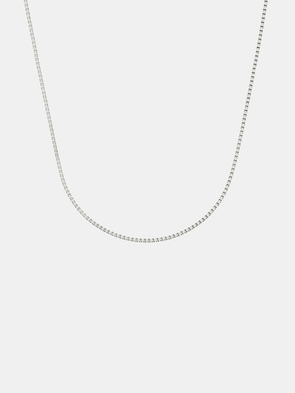 Silver box chain necklace on a light gray background