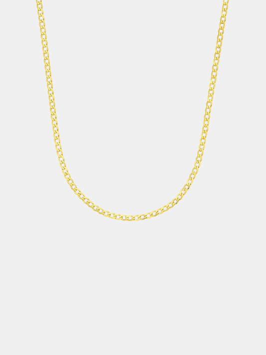 Gold chain necklace on a light gray background