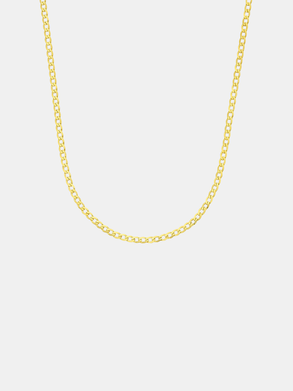 Gold chain necklace on a light gray background