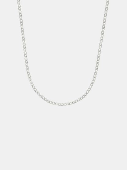 Silver chain necklace on a light gray background