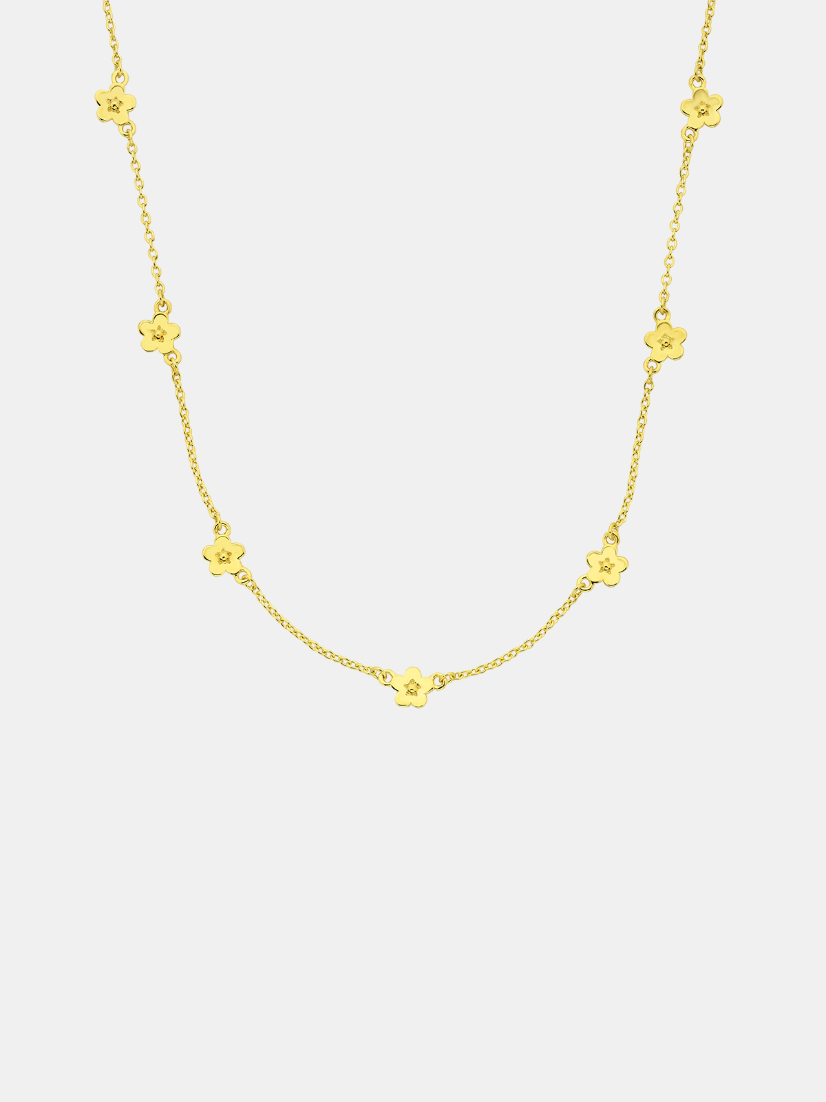 Gold necklace with floral pendants on a white background