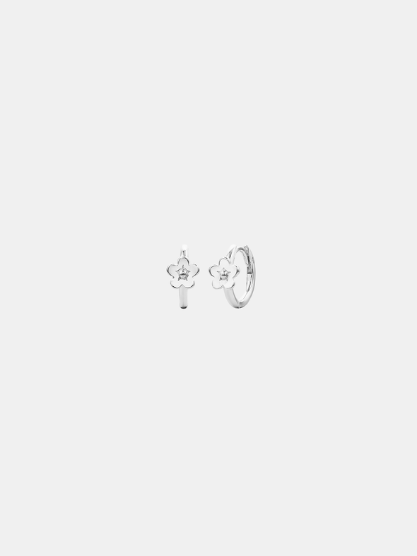 Pair of silver hoop earrings with floral designs on a light gray background