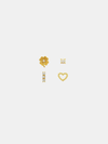 Four gold earrings on a white background