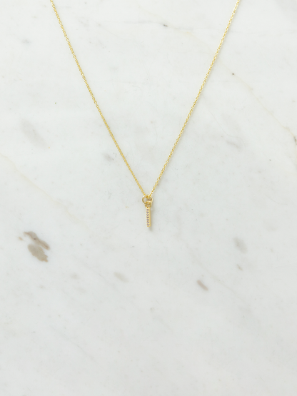 Gold necklace on a marble surface