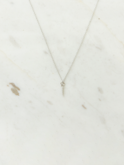 Silver necklace on a marble surface