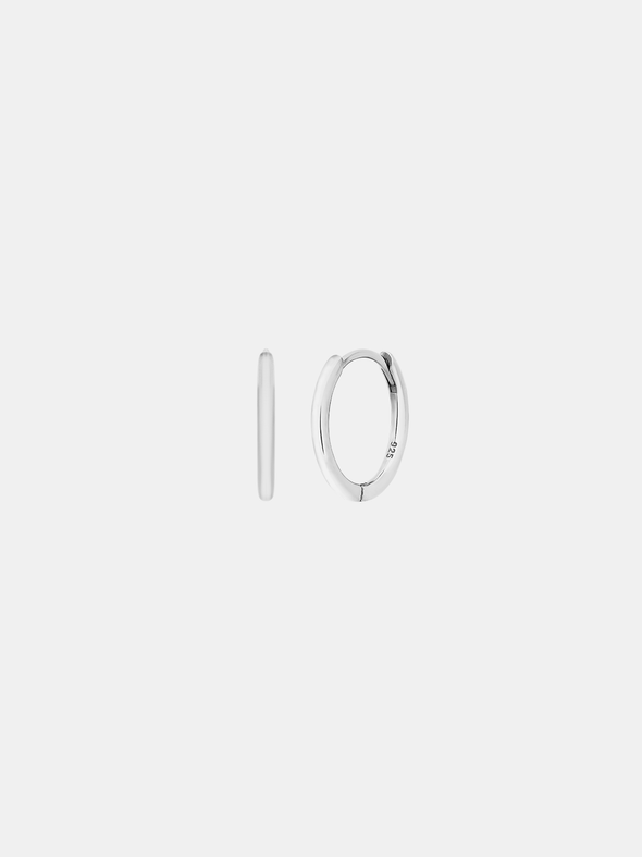 Silver hoop earrings on a light gray background