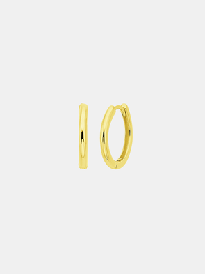 Gold hoop earrings on a light gray background
