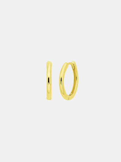 Gold hoop earrings on a light gray background