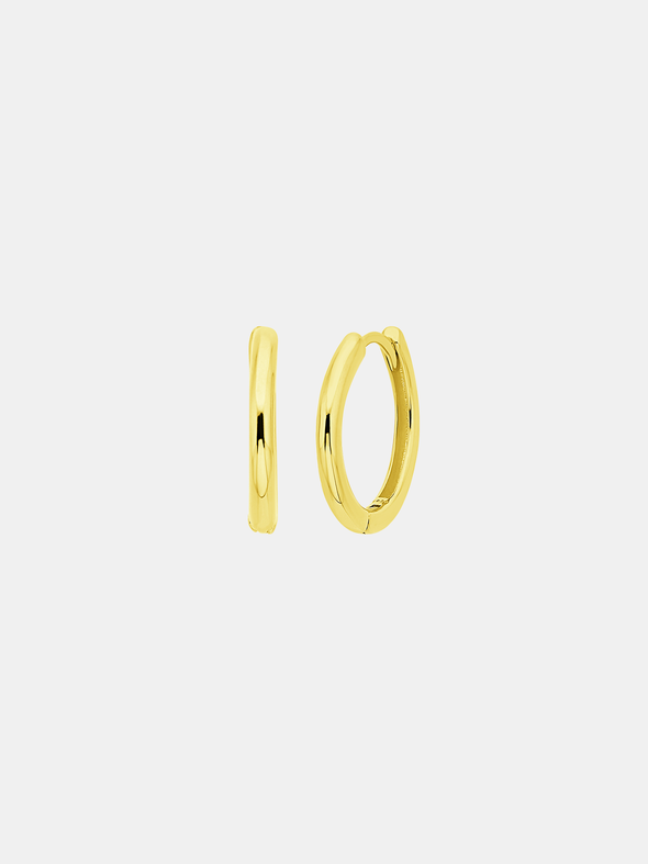 Gold hoop earrings on a light gray background