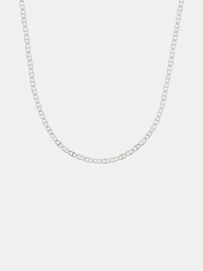 Silver chain necklace on a light gray background