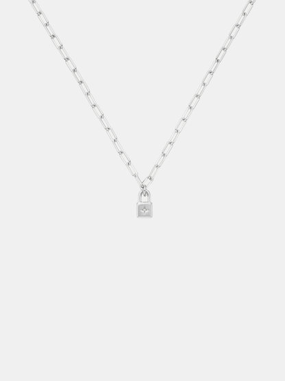 Silver necklace with a lock pendant on a white background