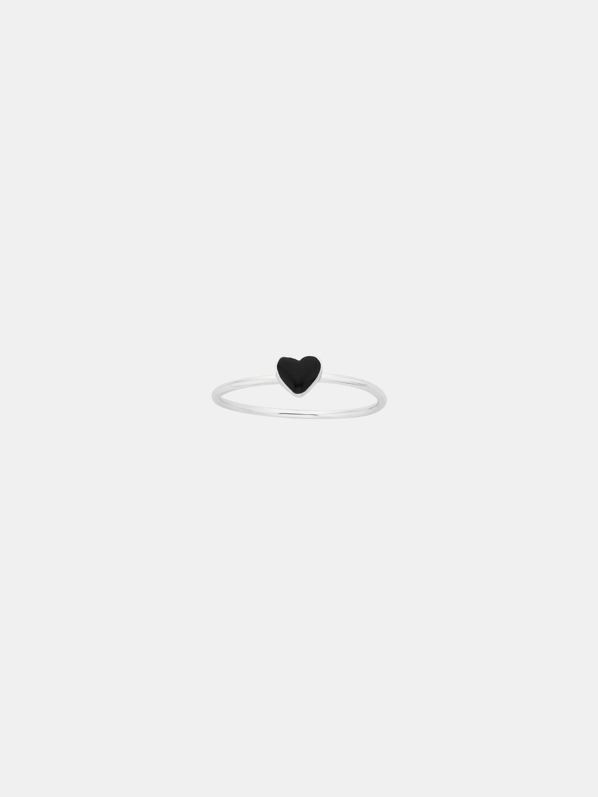 Black heart-shaped ring on a white background