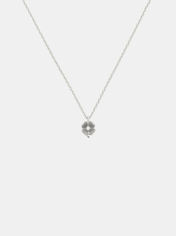 Silver necklace with a lily  pendant with small pearl on a light gray background