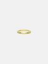 Gold ring on a light beige background