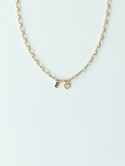 Solid gold mix it up necklace on mini links chain with two small pendants on a white background