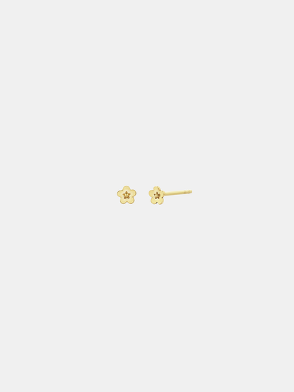Pair of solid gold flower-shaped stud earrings on a white background