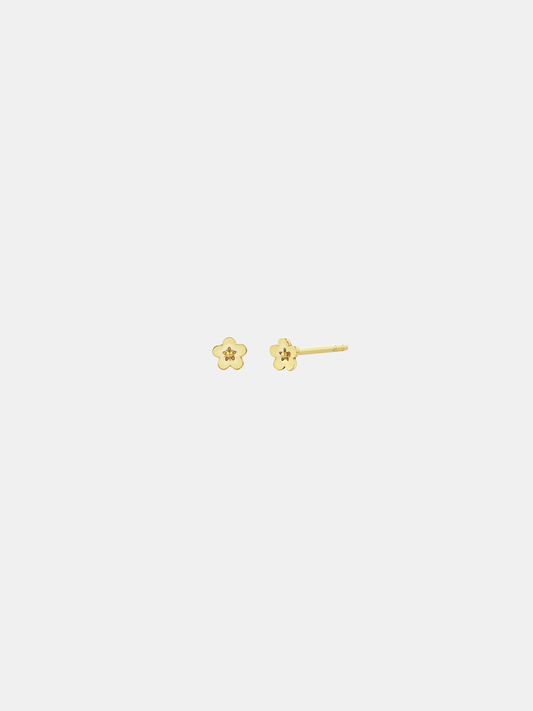 Pair of solid gold flower-shaped stud earrings on a white background