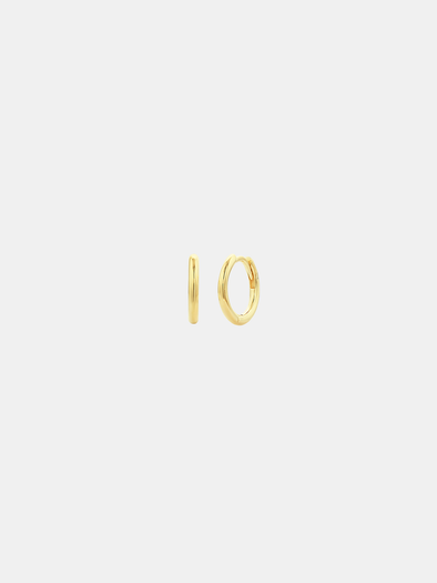 Gold hoop earrings on a light gray background