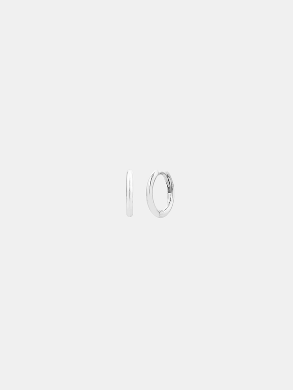 Silver hoop earrings on a light gray background