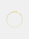 Pearl bracelet with gold clasp on a light gray background