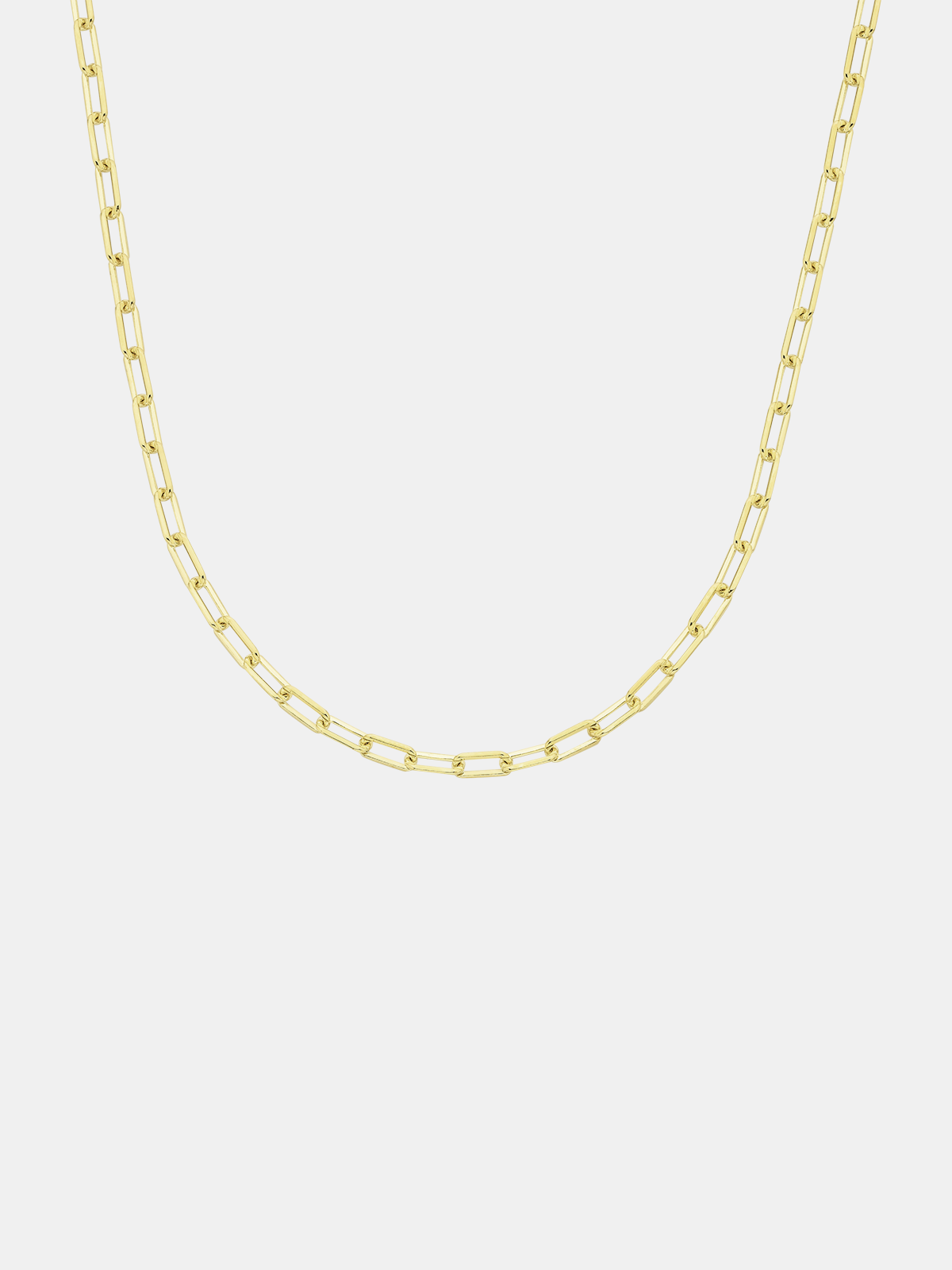 Solid gold mini links chain necklace on a light grey background
