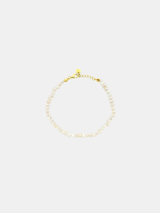 Mini pearl bracelet for kids on a light gray background