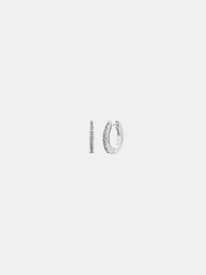 Pair of silver hoop earrings on a light gray background