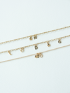Mix It Up solid gold charm bracelets on a variety of chains