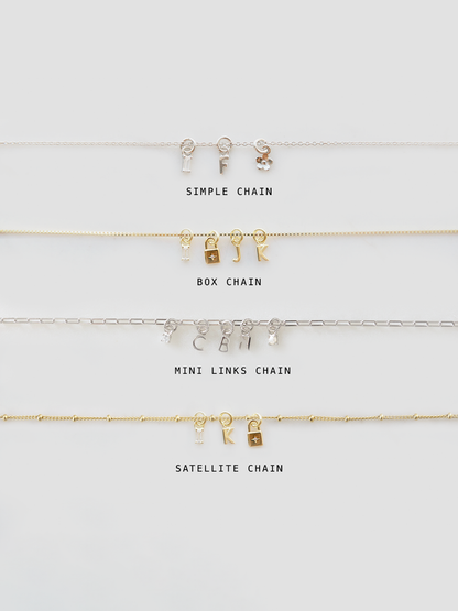 Collection of gold necklaces with different chain styles on a white background