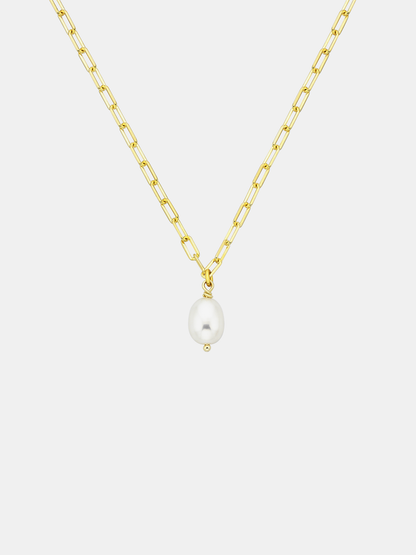 Gold chain necklace with a single pearl pendant on a light gray background