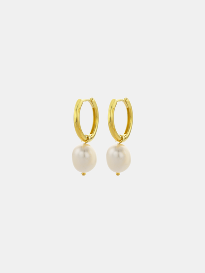Gold hoop earrings with pearls on a white background