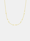 Gold chain pearl necklace on a white background