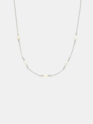 Necklace with small pearls on a light gray background