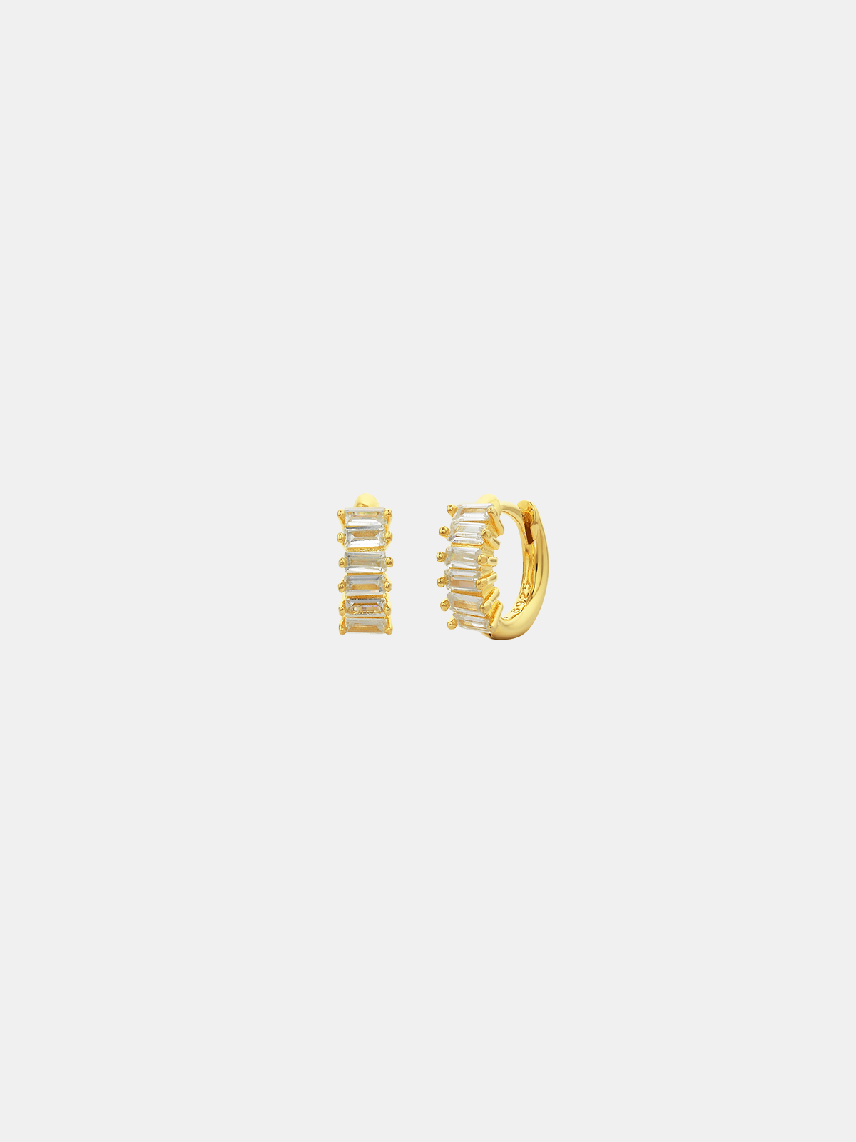 Gold hoop earrings with rocks on a white background