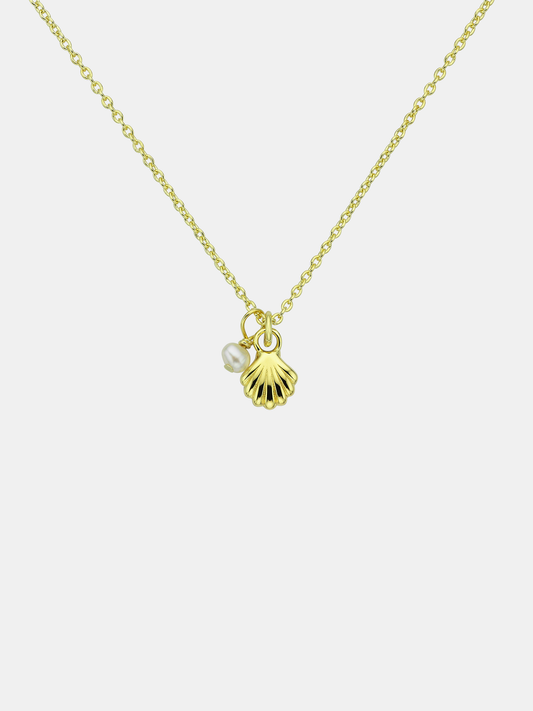 Gold necklace with shell and pearl charm on a white background