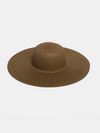 Moss green straw hat on a light gray background