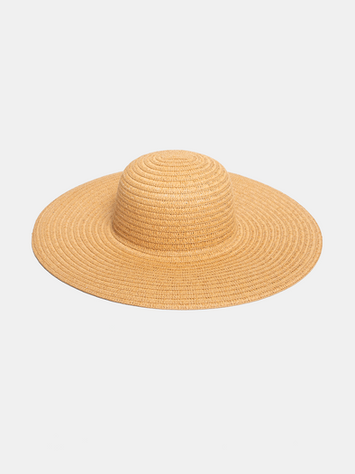 Beige straw hat on a light beige background