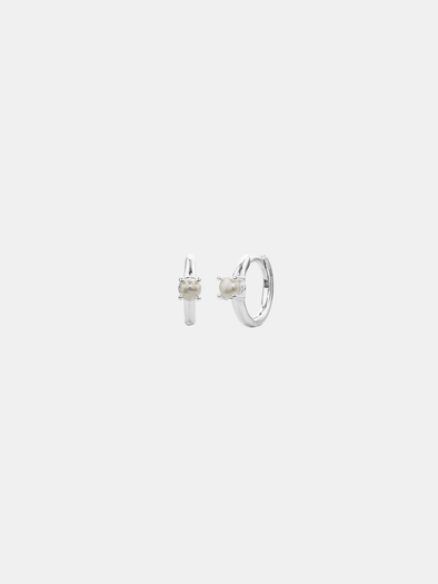 Pair of silver hoop earrings with a pearl on a white background